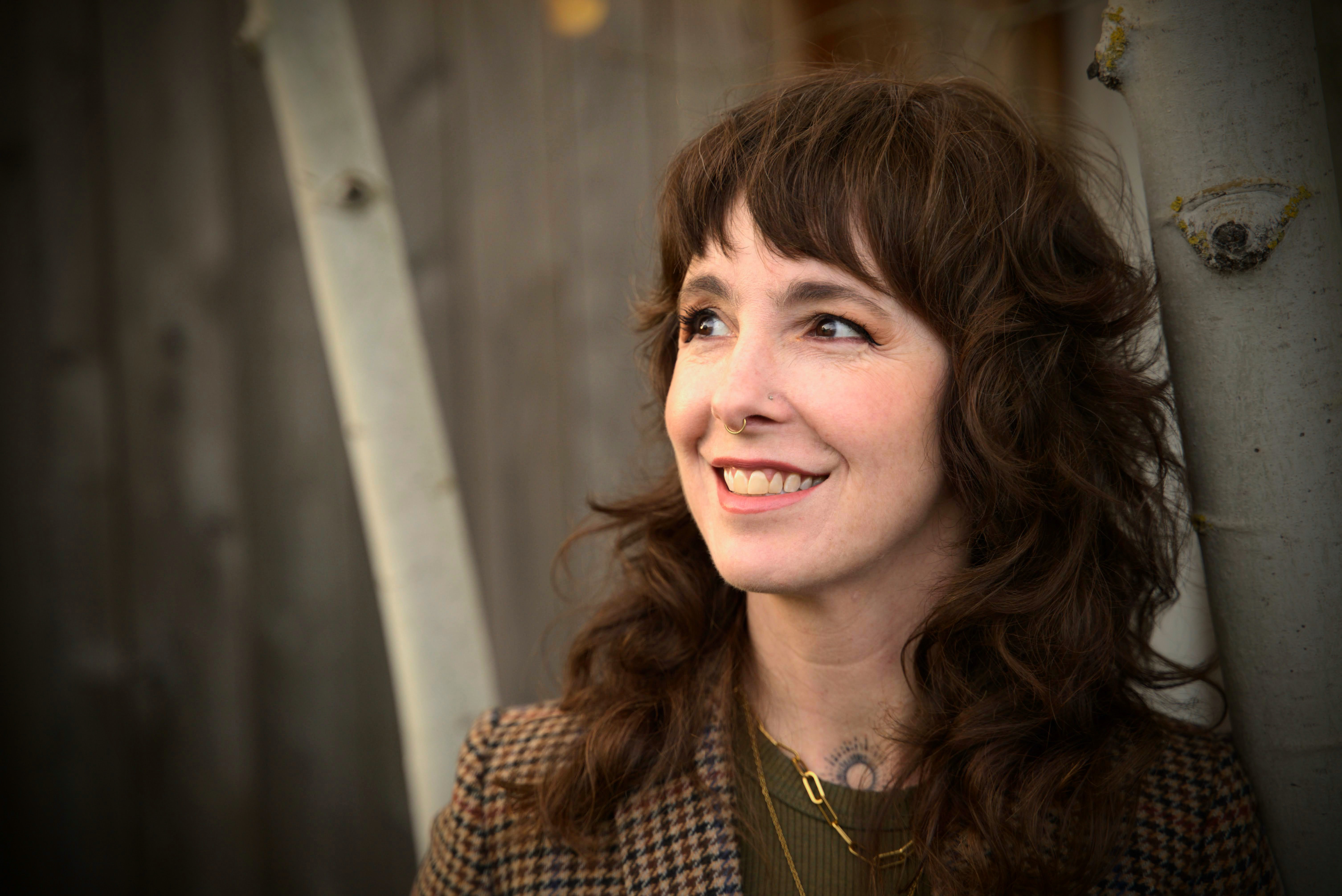 Coco McGraw Smith, PMHNP, looking to their right